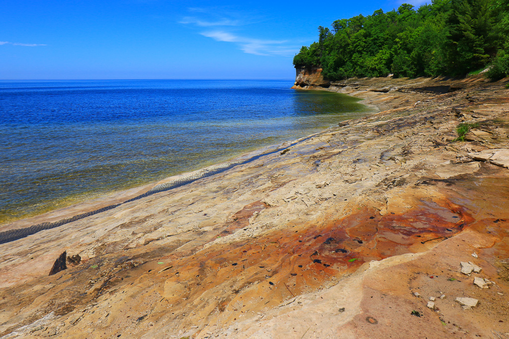 Colorful sandstone at Mosquito Beach - Chapel Loop