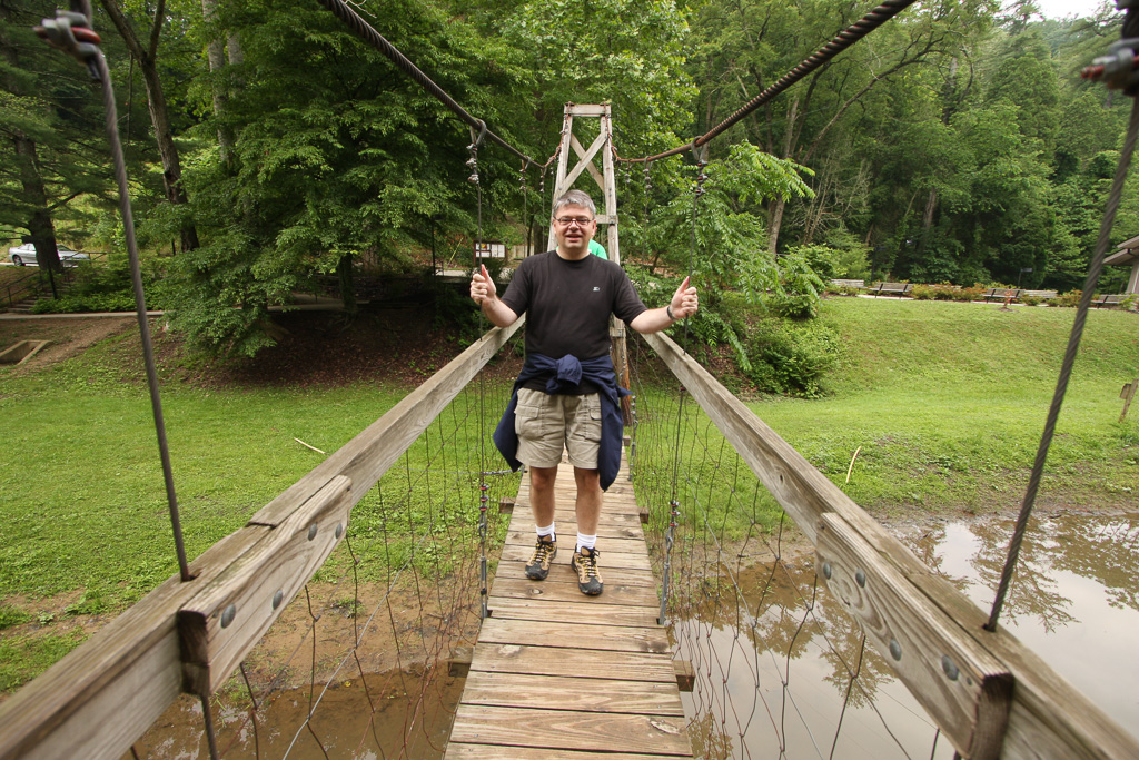 Reader on the suspension bridge - Original Trail/Balanced Rock Trail/Laurel Ridge Trail Loop to Natural Bridge