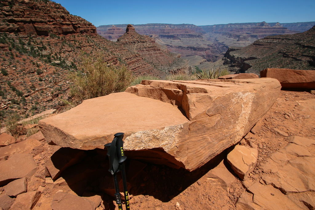 Trekking poles and boulder - Grand Canyon National Park, Arizona