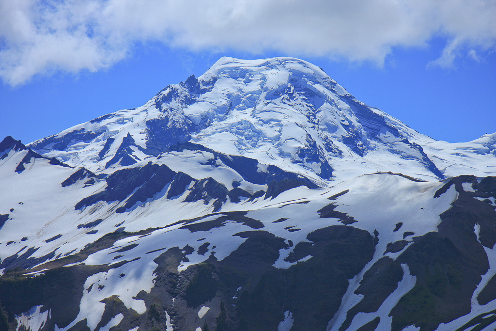 Kulshan, or Koma Kulshan, meaning “snow-capped mountain with a wound at the tip” in Lummi, or “hunting place in the mountains” in Nooksack, was named Mount Baker by George Vancouver in honor of his third-in-command in 1792 - Skyline Divide
