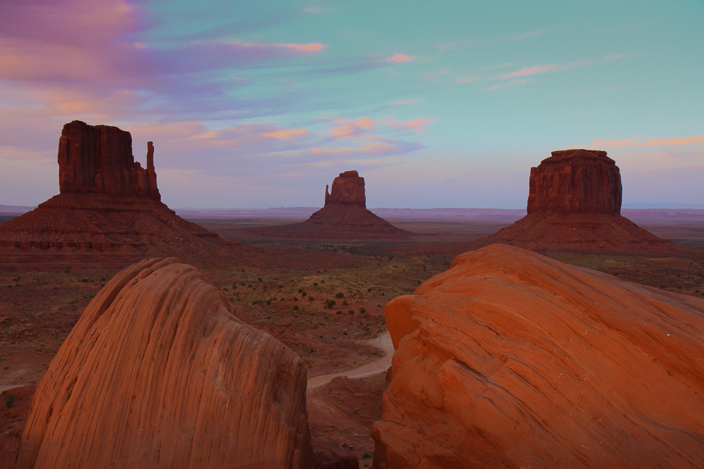 Colorful sky above The Mittens and Merrick Butte - Monument Valley, Arizona